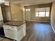 Spacious living room with wood floors, a front door, and a large window to let in natural light at 804 Little Wekiwa Dr, Altamonte Springs, FL 32714