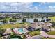 Aerial view of community amenities, including a pool, clubhouse, and lush landscaping, offering a luxurious lifestyle at 8440 Woburn Ct, Windermere, FL 34786