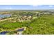 Expansive aerial view of a residential community with lush greenery and golf course at 8440 Woburn Ct, Windermere, FL 34786