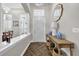 Inviting foyer with herringbone wood flooring, a console table, and views of the living spaces at 8440 Woburn Ct, Windermere, FL 34786