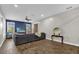 Spacious living room features a large sectional sofa and hardwood floors at 8440 Woburn Ct, Windermere, FL 34786