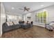 Spacious living room features a large sectional sofa and hardwood floors at 8440 Woburn Ct, Windermere, FL 34786