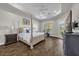 Spacious main bedroom with trey ceiling, hardwood floors, and access to the backyard at 8440 Woburn Ct, Windermere, FL 34786