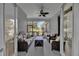 Relaxing screened patio with comfortable seating and view of the backyard at 8440 Woburn Ct, Windermere, FL 34786