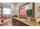 Stylish bathroom featuring granite countertops, modern fixtures, and a large mirror at 8606 Lsu Ln, Orlando, FL 32817