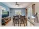 Bright dining room featuring tile floors and doors leading to an outdoor area at 8606 Lsu Ln, Orlando, FL 32817