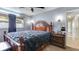 Comfortable main bedroom featuring dark wood accents and great natural lighting at 8606 Lsu Ln, Orlando, FL 32817