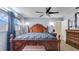 Comfortable main bedroom featuring dark wood accents and great natural lighting at 8606 Lsu Ln, Orlando, FL 32817