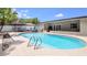 Backyard pool featuring a seating area, gazebo, white fencing, and ample space for lounging and recreation at 8606 Lsu Ln, Orlando, FL 32817