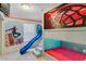 Bedroom featuring custom bunkbeds with a slide and unique Spider-Personal themed decor at 8814 Geneve Ct, Kissimmee, FL 34747