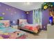 Whimsical bedroom with colorful princess-themed decor and painted tree mural at 8814 Geneve Ct, Kissimmee, FL 34747