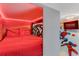 Unique Marvel themed bedroom featuring creative built-in bunk bed with red color accents at 8814 Geneve Ct, Kissimmee, FL 34747