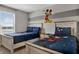 Charming bedroom featuring two twin beds with themed bedding and Mickey Mouse wall decor at 8814 Geneve Ct, Kissimmee, FL 34747