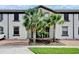 Inviting townhouse featuring meticulously landscaped frontage and private brick paved driveway at 8814 Geneve Ct, Kissimmee, FL 34747