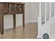 Foyer showcases a decorative table and a charming miniature door at the base of the staircase at 8814 Geneve Ct, Kissimmee, FL 34747