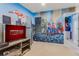 Game room with custom wall art and a doorway leading to another themed bedroom at 8814 Geneve Ct, Kissimmee, FL 34747