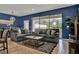 Spacious living room boasts tile flooring, sliding glass doors to the lanai and comfortable seating at 8814 Geneve Ct, Kissimmee, FL 34747