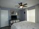 Bedroom features a ceiling fan, and a large window for plenty of natural light at 9313 Pavillion Dr, Orlando, FL 32825