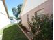 Exterior view of home featuring a green lawn, flower beds, and brick paver walkway at 9313 Pavillion Dr, Orlando, FL 32825