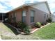 Charming home with well-maintained landscaping and neutral exterior paint scheme at 9313 Pavillion Dr, Orlando, FL 32825