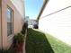 Exterior side view of home and yard at 9313 Pavillion Dr, Orlando, FL 32825