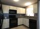 Bright kitchen featuring white cabinets, modern appliances, and granite countertops at 9313 Pavillion Dr, Orlando, FL 32825