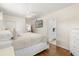Bedroom featuring hardwood floors, ceiling fan, and closet with sliding doors at 932 Campbell Ave, Lake Wales, FL 33853