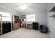 Finished bedroom featuring tiled flooring, neutral walls, and storage shelves at 941 Barbados Ave, Orlando, FL 32825