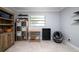 Finished bedroom featuring tiled flooring, neutral walls, and storage shelves at 941 Barbados Ave, Orlando, FL 32825
