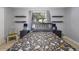 Bedroom featuring a patterned duvet, gray furniture, and natural light from the window at 941 Barbados Ave, Orlando, FL 32825