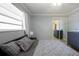 Neutral bedroom with tiled flooring, window with blinds, and dresser set at 941 Barbados Ave, Orlando, FL 32825