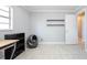Finished bedroom featuring tiled flooring, neutral walls, and storage shelves at 941 Barbados Ave, Orlando, FL 32825