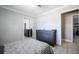Bright bedroom featuring tiled flooring, neutral walls, and mirror closet at 941 Barbados Ave, Orlando, FL 32825