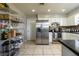 Spacious kitchen includes stainless steel appliances, white cabinets, and ample counter space at 941 Barbados Ave, Orlando, FL 32825