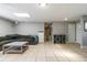 Spacious living room with tile floors and a comfortable gray sectional sofa at 941 Barbados Ave, Orlando, FL 32825