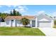 Charming single-story home with a well-manicured lawn and a neatly paved driveway at 996 Big Oaks Dr, Oviedo, FL 32765