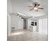 Expansive living area with tiled floors, featuring an open layout with the kitchen and access to the entryway at 996 Big Oaks Dr, Oviedo, FL 32765