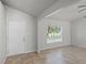 Bright living room with tiled floor, ceiling fan, and a view to the outdoors through a window at 996 Big Oaks Dr, Oviedo, FL 32765