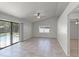 Open-concept living space with neutral tile flooring and sliding glass doors leading to the pool area at 996 Big Oaks Dr, Oviedo, FL 32765