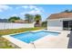 Clean backyard swimming pool featuring privacy fence with house in the background at 996 Big Oaks Dr, Oviedo, FL 32765