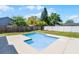Backyard pool with concrete patio and surrounding landscaping for outdoor enjoyment at 996 Big Oaks Dr, Oviedo, FL 32765