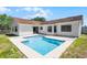 Swimming pool with concrete patio and adjacent to house, surrounded by a fenced in yard at 996 Big Oaks Dr, Oviedo, FL 32765