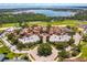 Aerial view of a community with a lake, golf course, and swimming pool at 16825 Bolsena Dr, Montverde, FL 34756