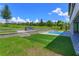 Beautiful backyard with a modern grill, pool and well-maintained lawn at 16825 Bolsena Dr, Montverde, FL 34756