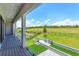 Balcony view of outdoor kitchen, grill, and swimming pool at 16825 Bolsena Dr, Montverde, FL 34756