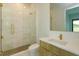 Modern bathroom featuring a glass shower, and gold fixtures at 16825 Bolsena Dr, Montverde, FL 34756