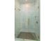 Modern bathroom featuring a frameless glass shower with elegant tile at 16825 Bolsena Dr, Montverde, FL 34756