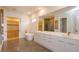 Luxurious bathroom with free standing tub, double sink vanity, and walk-in closet at 16825 Bolsena Dr, Montverde, FL 34756