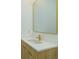 Elegant bathroom vanity with gold fixtures and a modern mirror at 16825 Bolsena Dr, Montverde, FL 34756