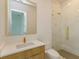 Modern bathroom with a wood vanity, a vessel sink, and a glass-enclosed shower at 16825 Bolsena Dr, Montverde, FL 34756